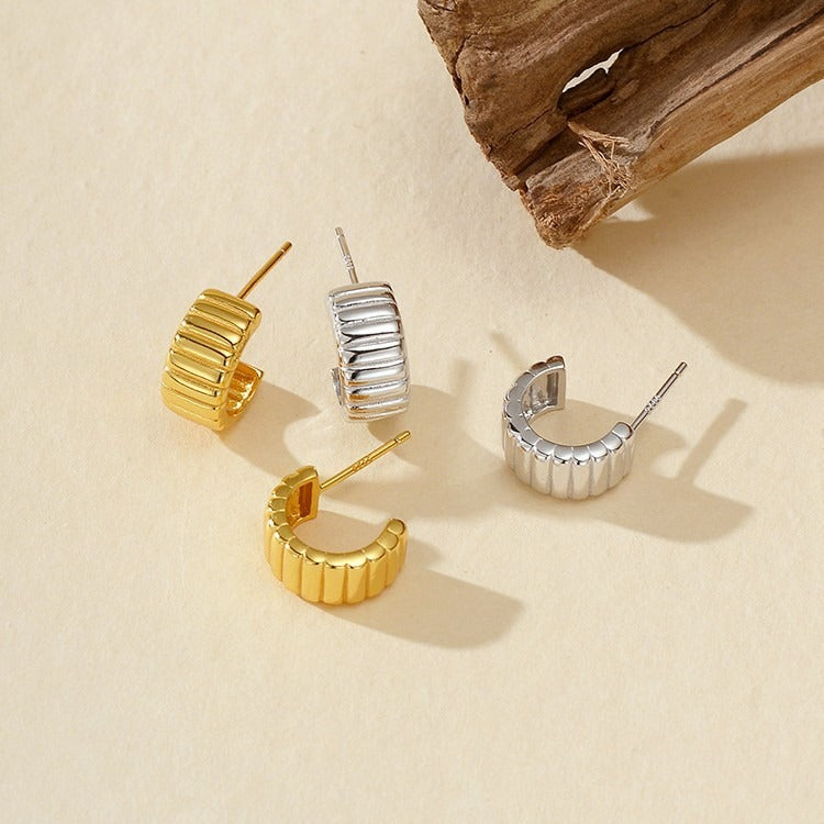 18K gold-plated, solid sterling silver C-shaped hoop earrings.